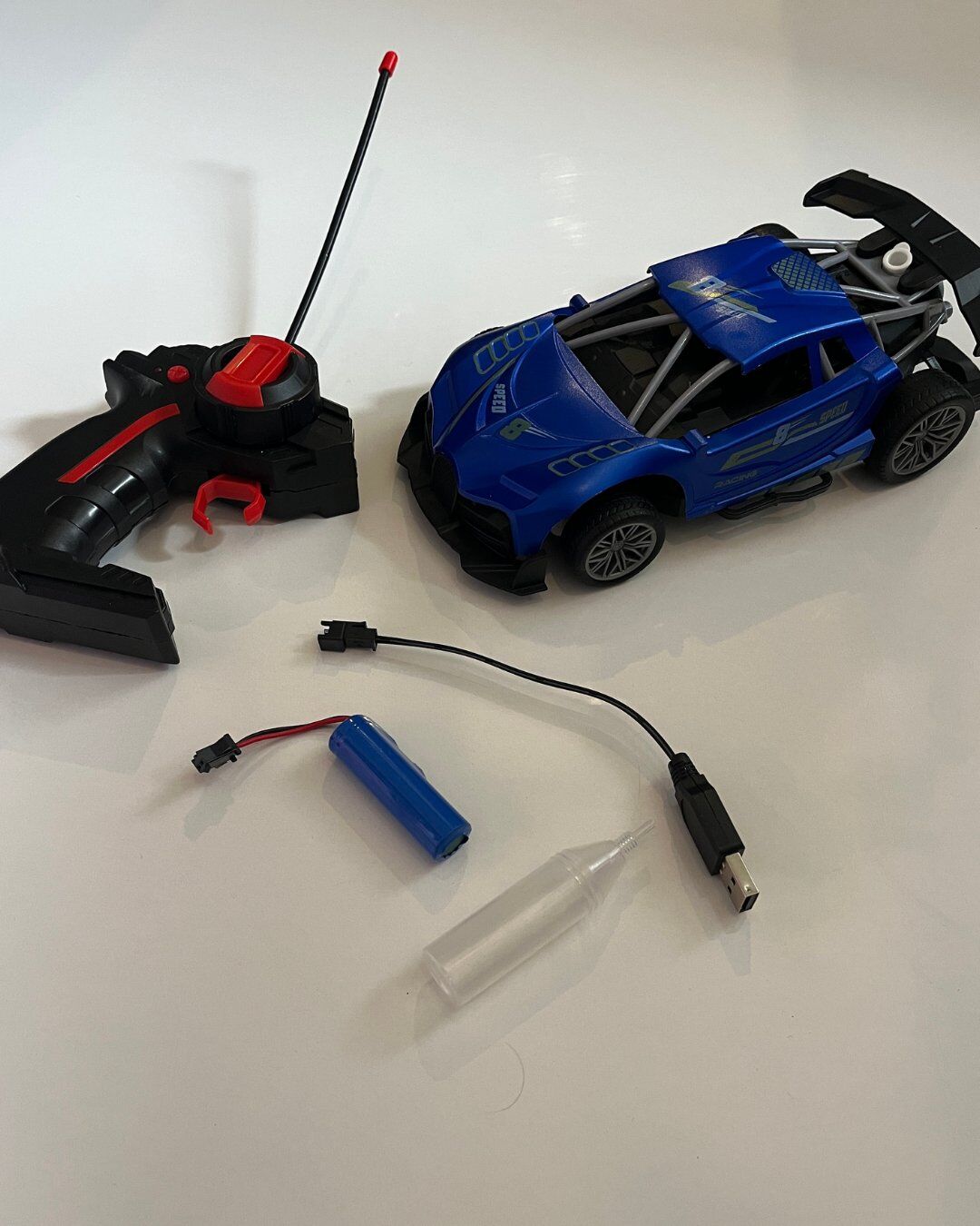 Uzaktan Kumandalı 5 Fonksiyonlu Duman Atan Işıklı Şarjlı Araba Mavi Renk 20x11 Cm